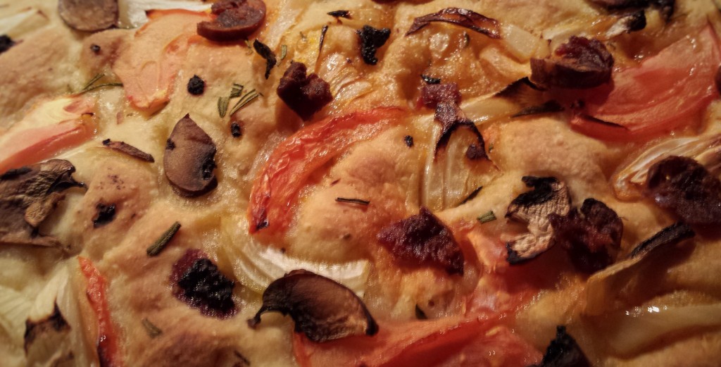 Focaccia with shallots, rosemary and thinly sliced tomatoes